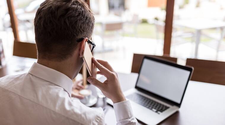 Technology person taking a client's phone call