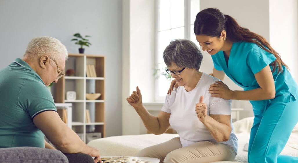 Skilled and Caring Personal Support Worker, encouraging senior couple